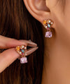 Pink heart stud earrings with CZ cube drop