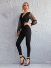 Surplice Neck Polka Dot Flocked Mesh Sleeve Self Belted Jumpsuit